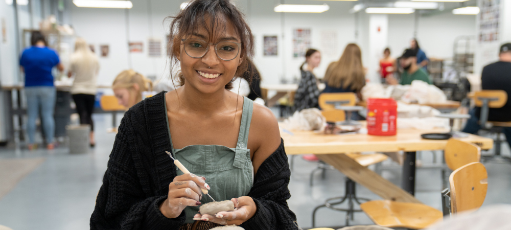 student in ceramics class